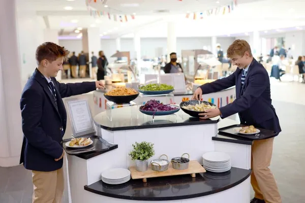 Delicious buffet catering spread with kebabs, roasted vegetables, and fresh salads at Glenny Kebabs.