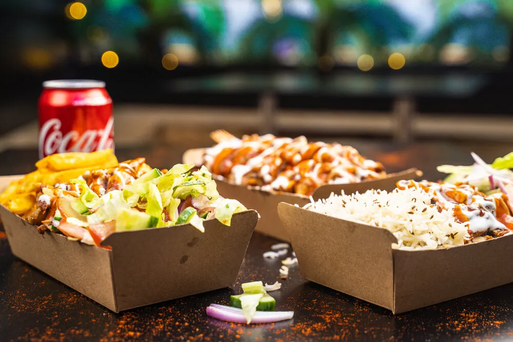 Delicious chicken Rise wrap with fresh veggies and a tangy sauce at Glenny Kebabs