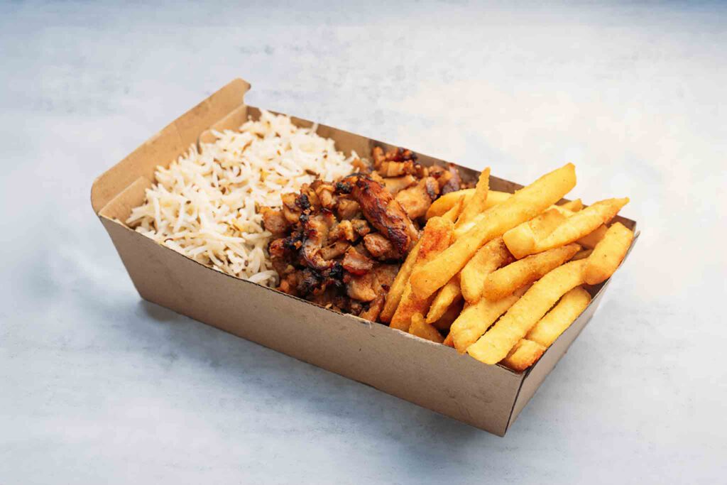 Carb Overload meal with lamb, chicken, or a mix, served with seasoned chips and cumin-infused basmati rice for a satisfying, carb-filled dish.