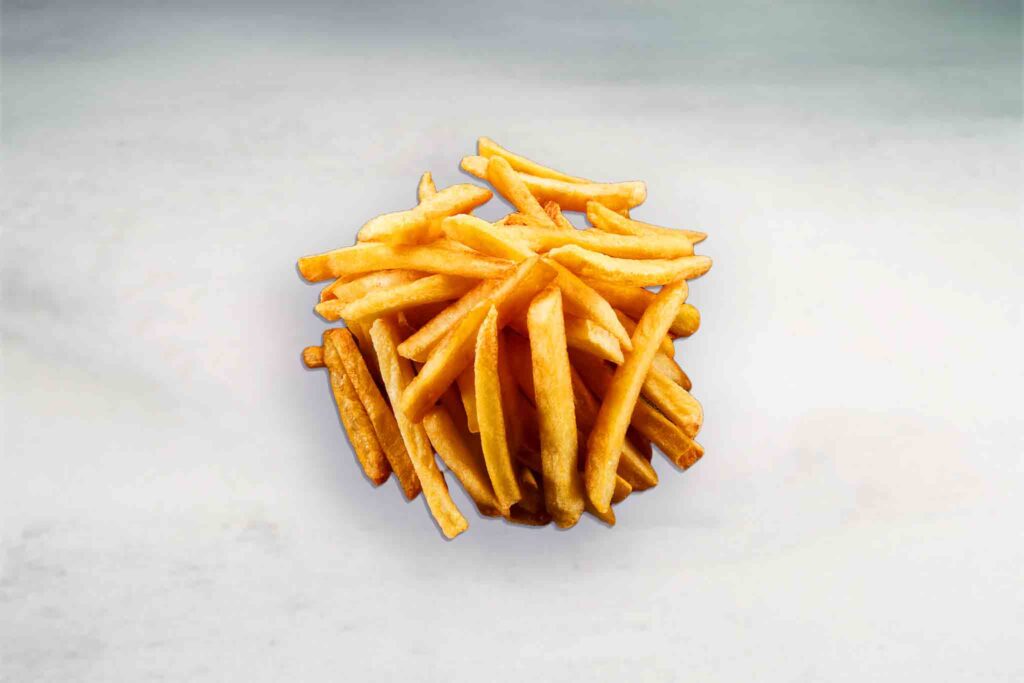 A serving of golden fried chips made from 100% Australian potatoes, seasoned with flavorful spices and served crispy and fresh.