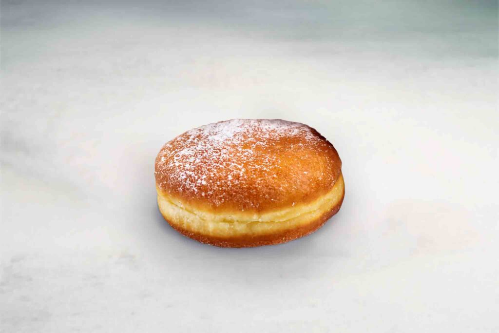 Baked and fried donut filled with your choice of sweet filling, offering a deliciously crispy exterior and soft, flavorful interior.