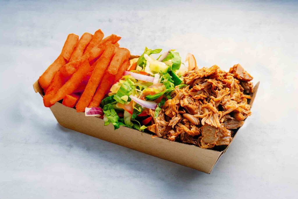 Gluten Friendly meal with chicken or falafel, served with garden salad and sweet potato fries for a satisfying and balanced gluten-free dish.