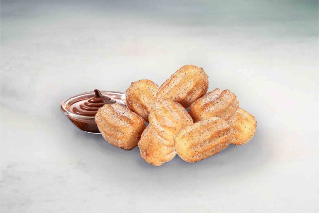 Mini churros rolled in cinnamon sugar, served with Nutella or Biscoff dip for a sweet dessert.