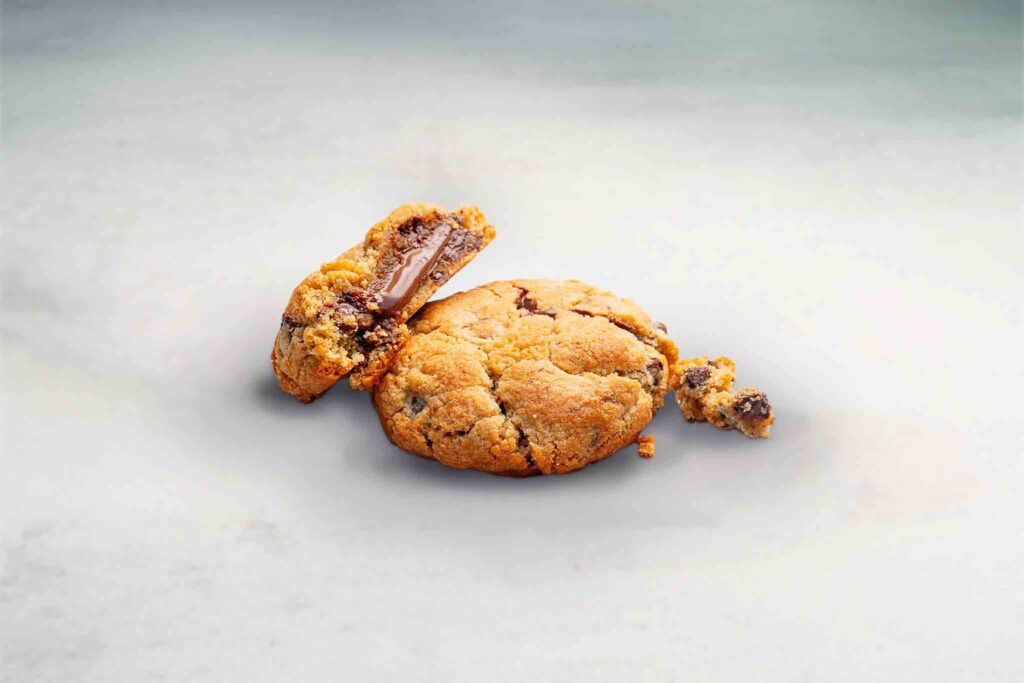 A soft and chewy NYC Chunky Cookie filled with Nutella and chocolate chips or Biscoff, perfect for satisfying your sweet tooth.