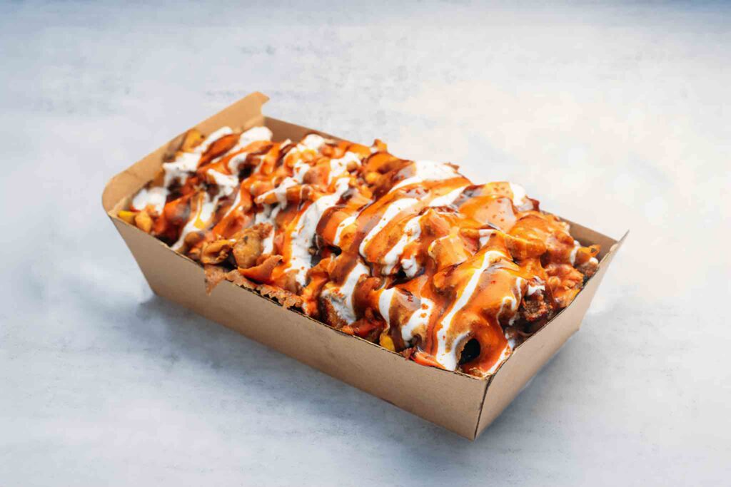 Regular Halal Snack Pack with crispy fries, melted mozzarella cheese, your choice of lamb, chicken, or mixed meat, drizzled with savory sauces.