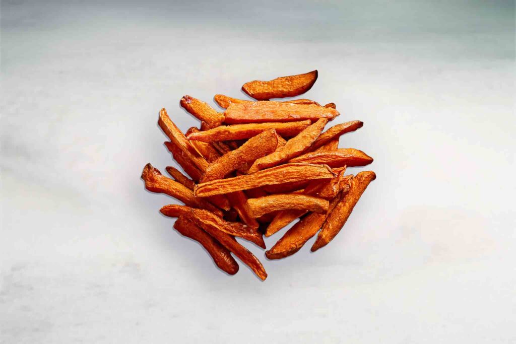 Image of crispy golden fried sweet potato fries, perfectly seasoned and served as a side dish or snack.