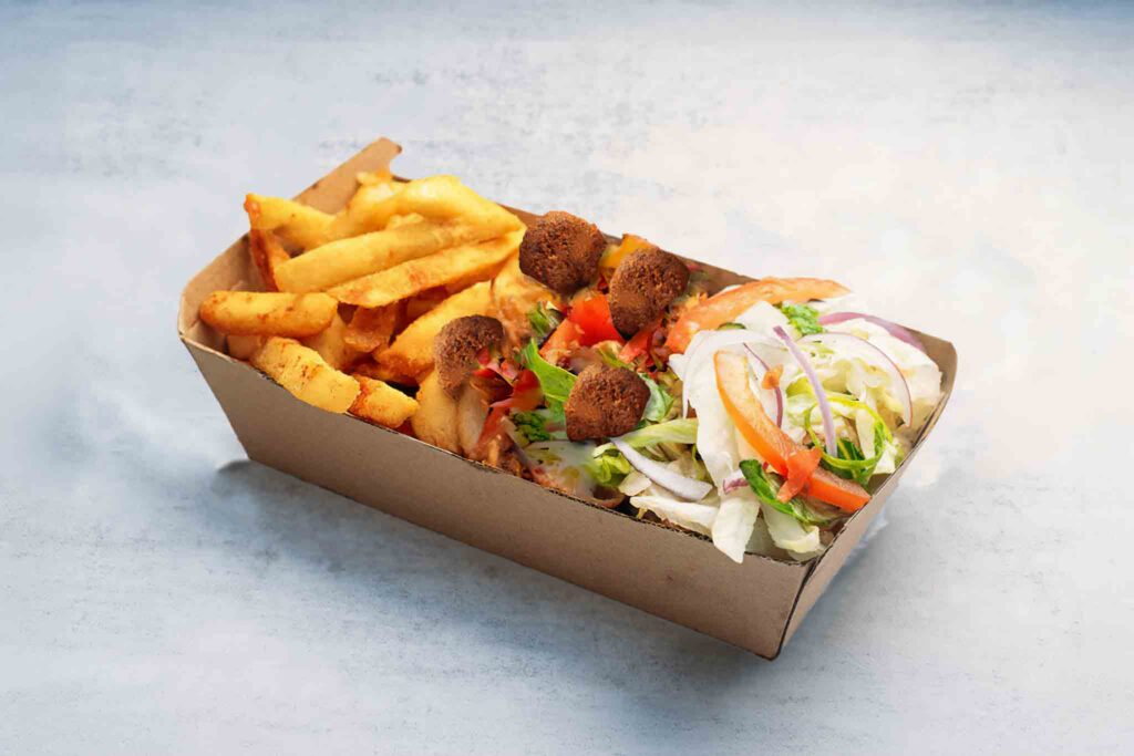 Crispy falafels served with fresh garden salad, seasoned chips, or cumin-infused basmati rice, offering a delicious plant-based meal.